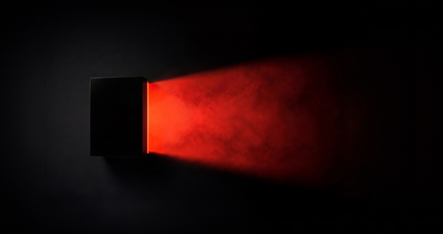 Black box with red light pouring from the lid